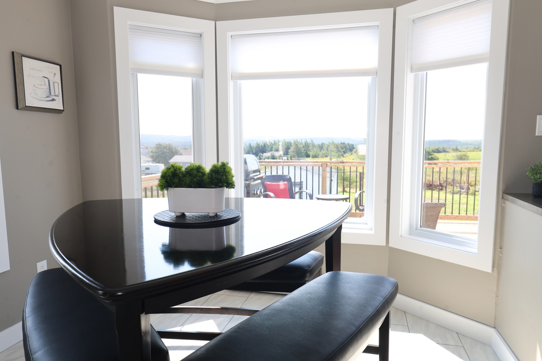 Dining area overlooking the deck at Doyle's Haven