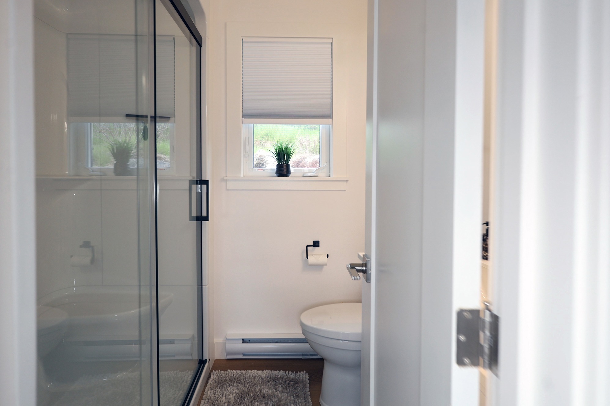 Modern bathroom with walk-in shower at The Harbour House